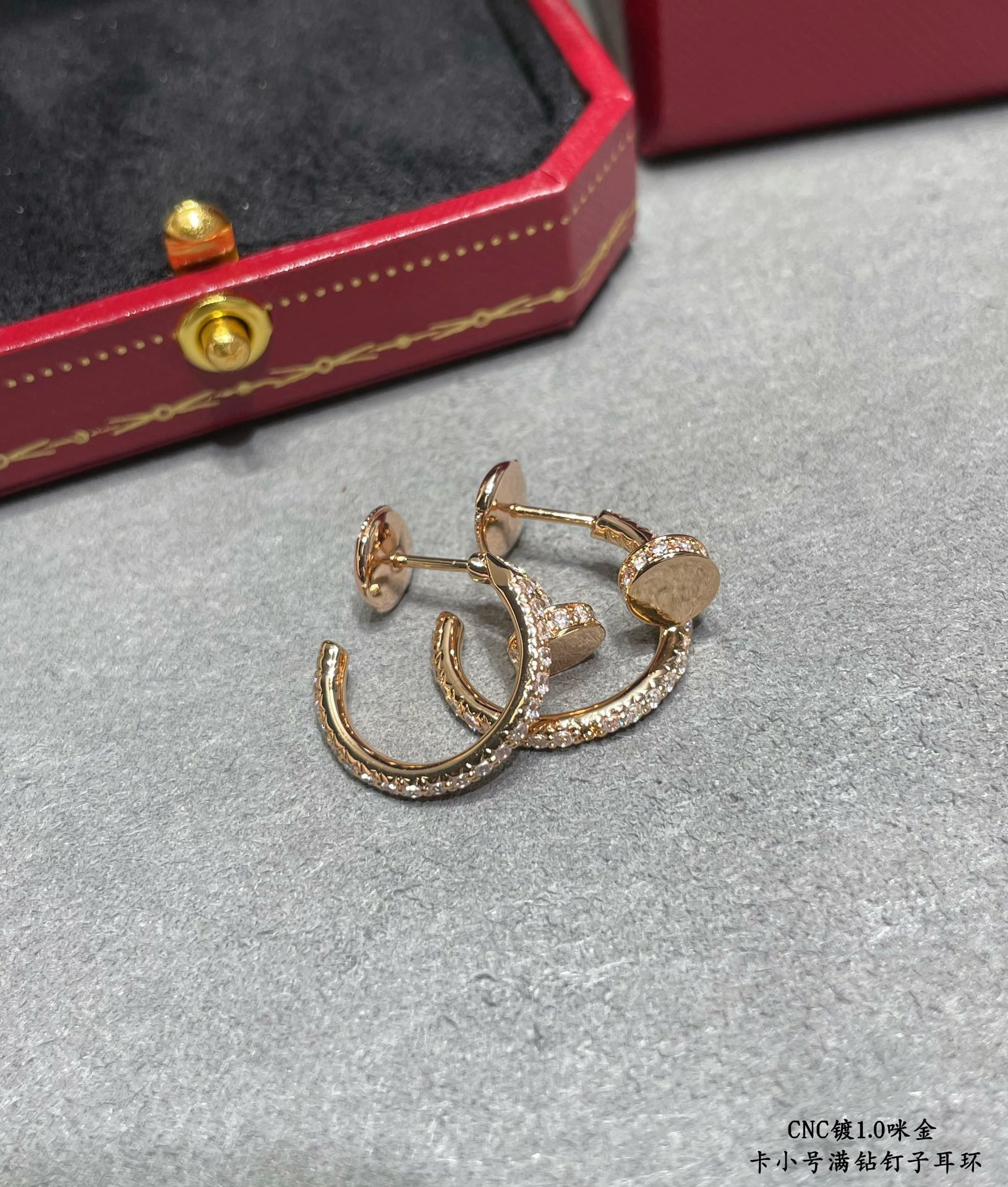 ca*t*er fully Di*m*nd-encrusted small nail earrings