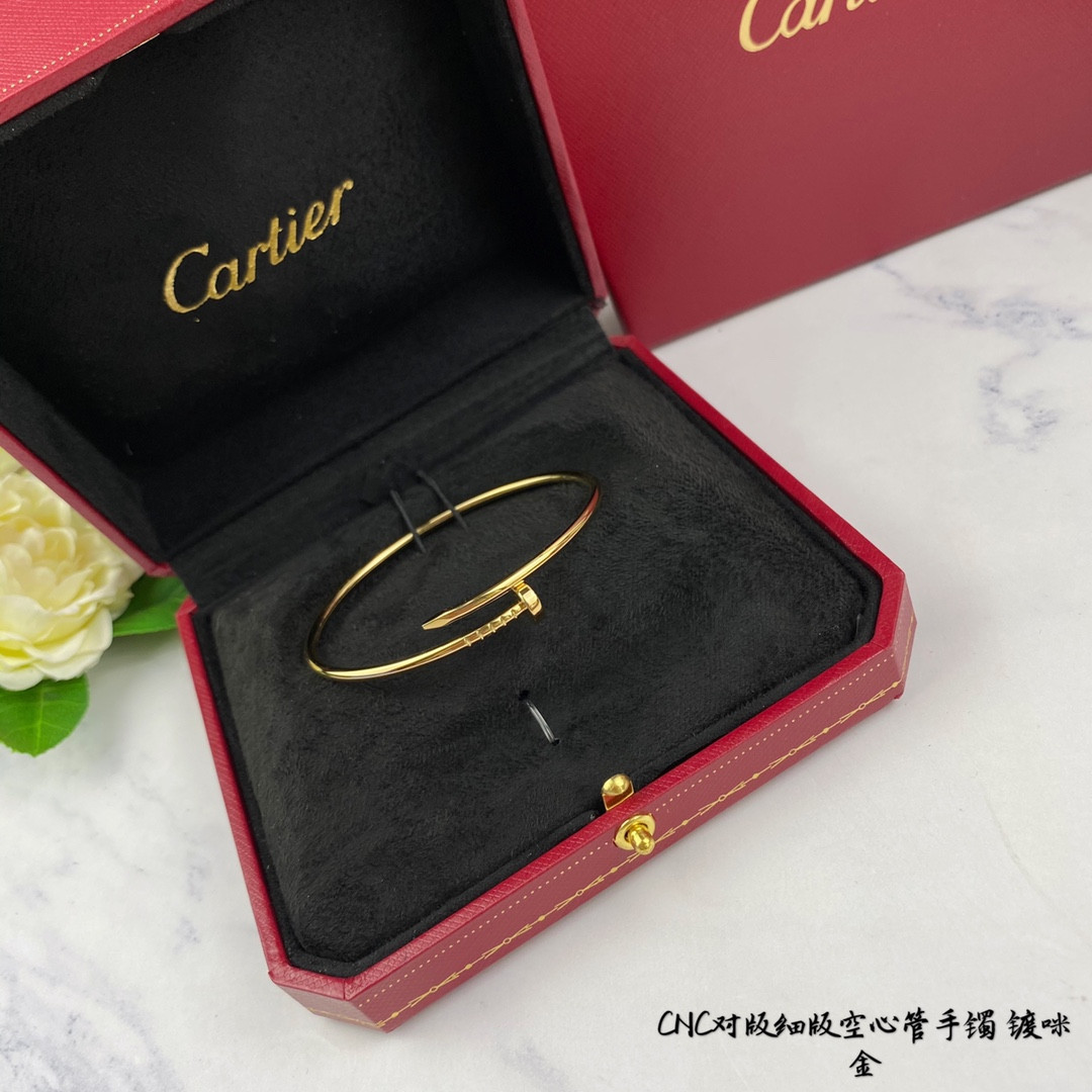 Ca*t*er thin hollow tube polished nail bracelet