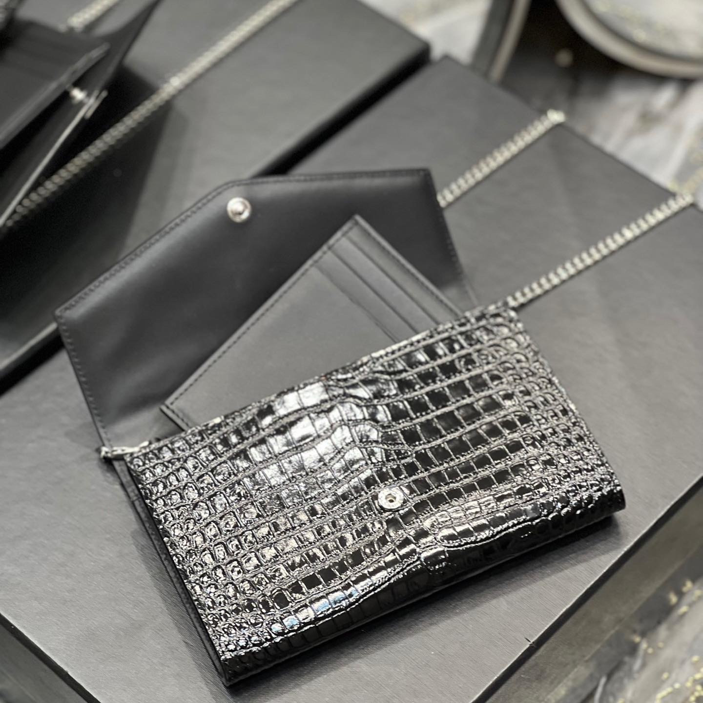 UPTOWN CHAIN WALLET IN CROCODILE-EMBOSSED SHINY LEATHER
