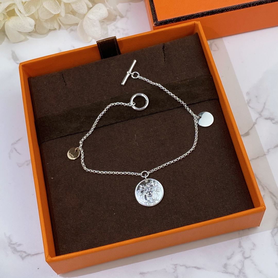 H**mes coin bracelet