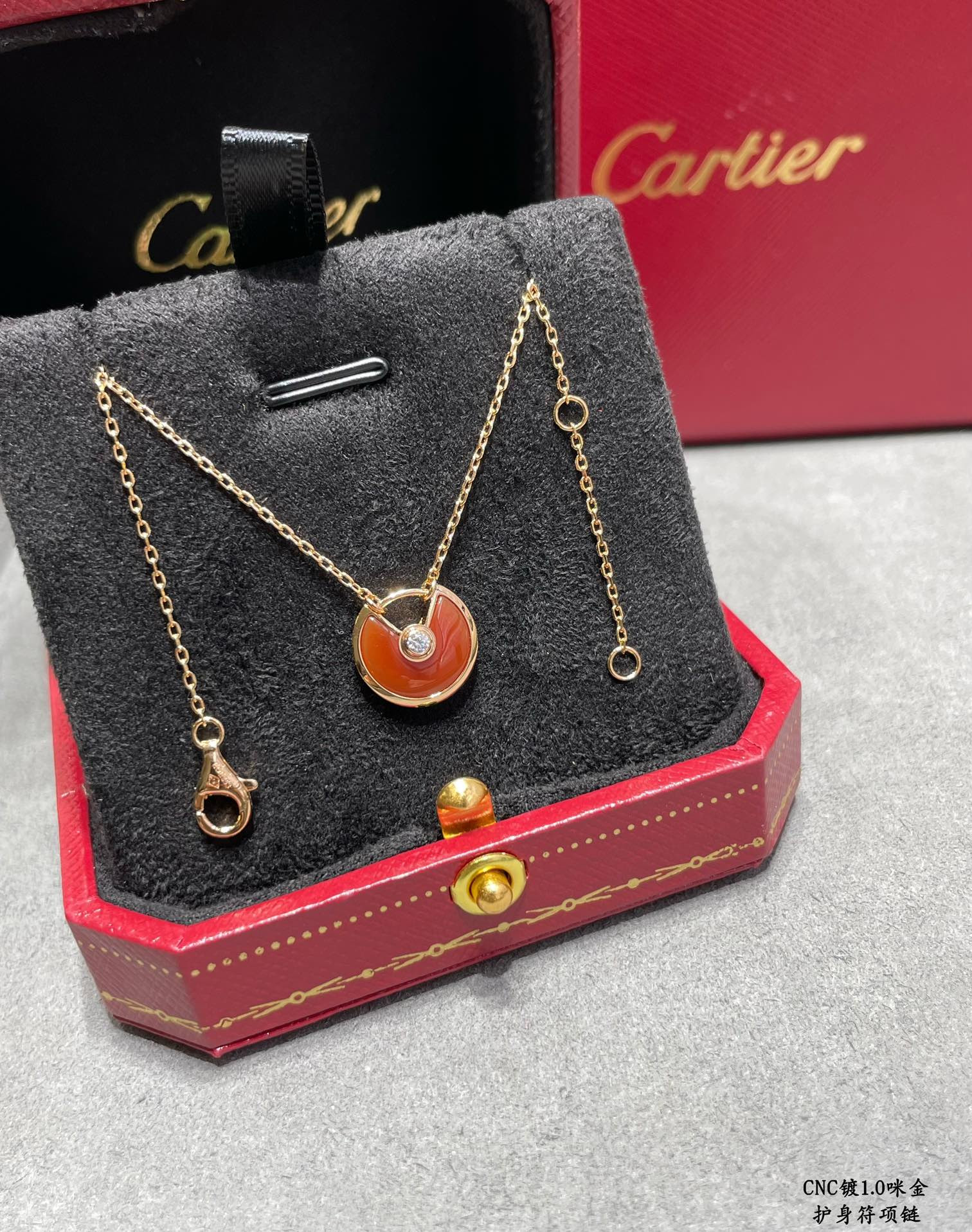 Ca*t*er amulet necklace