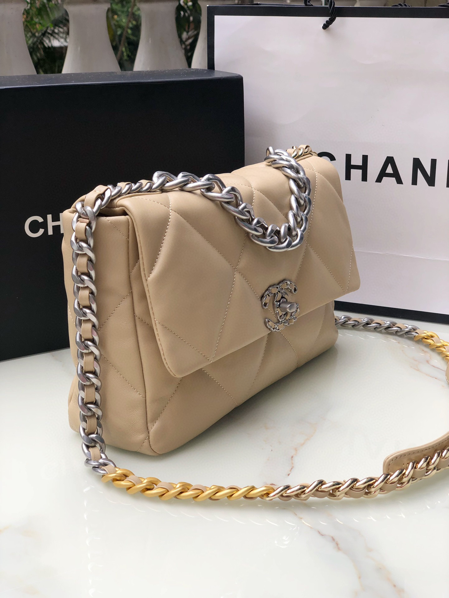 Ch*el 19 handbag shiny leather, gold-tone, silver-tone & ruthenium-finish metal beige 30x20x10cm