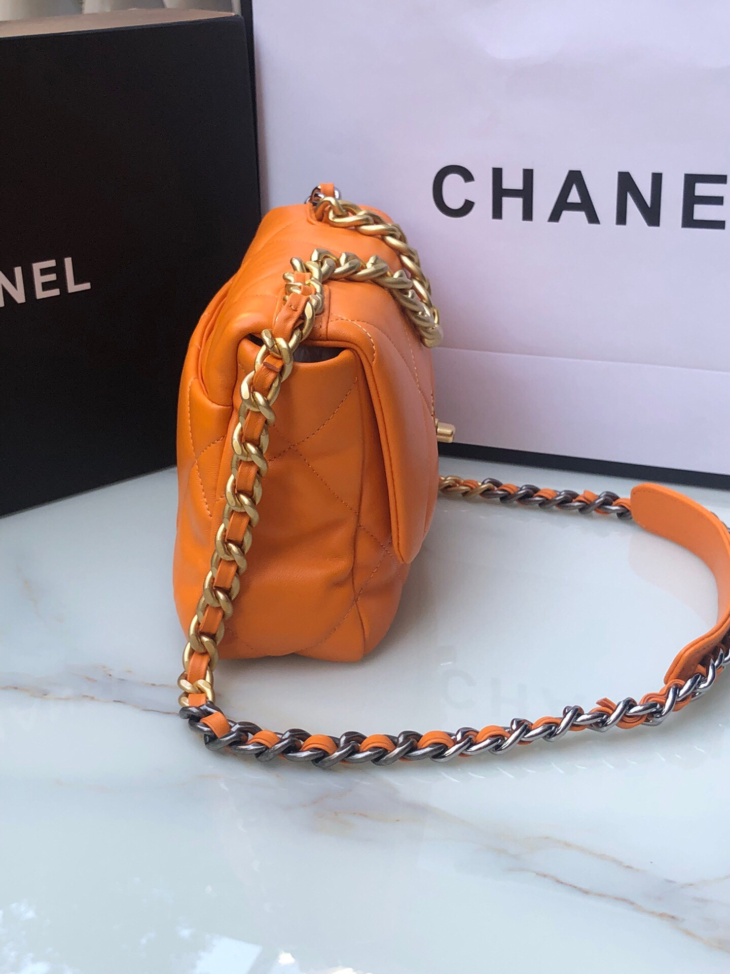 Ch*el 19 handbag shiny leather, gold-tone, silver-tone & ruthenium-finish metal orange 6.2 × 10.1 × 3.5 in