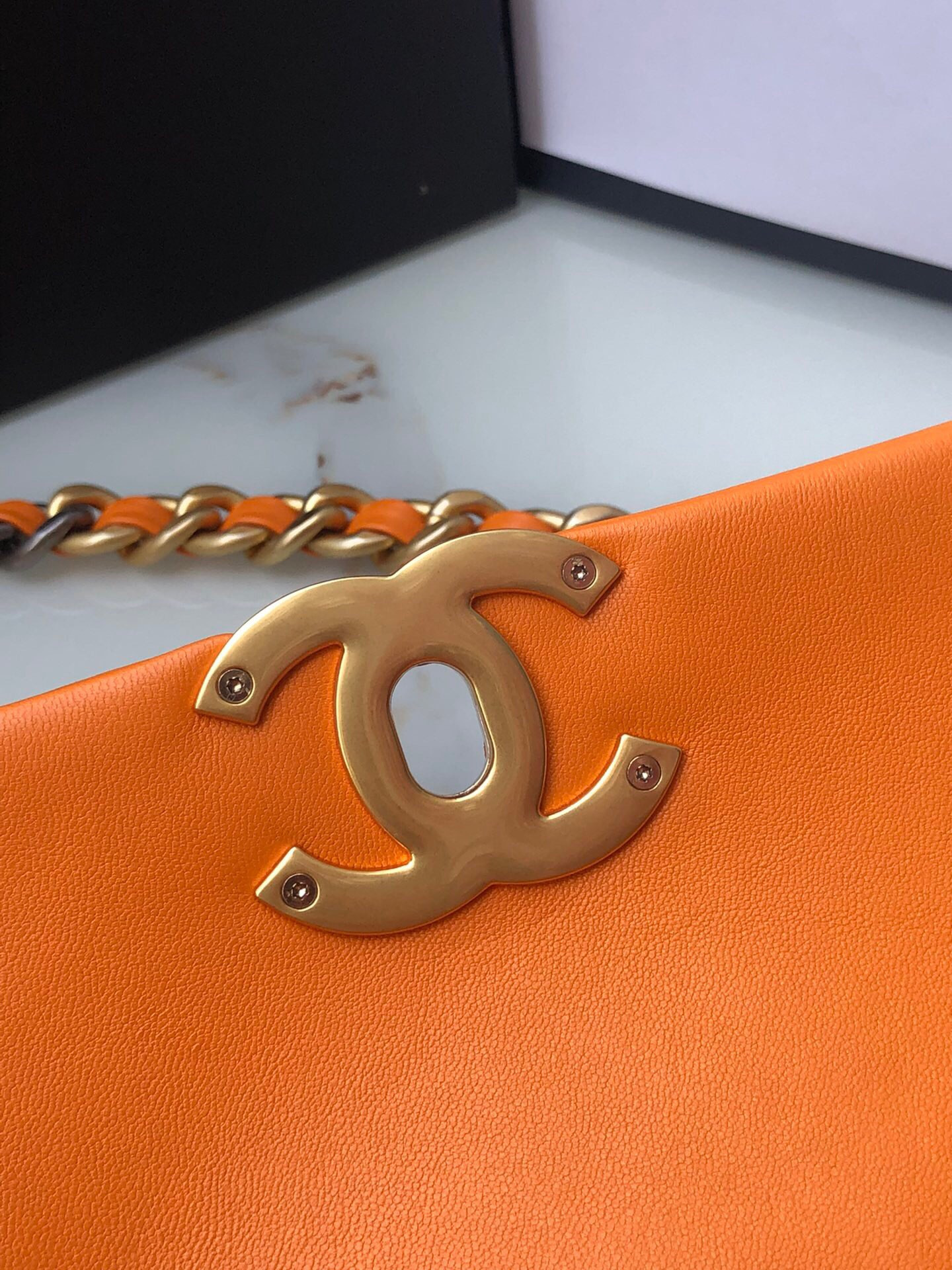 Ch*el 19 handbag shiny leather, gold-tone, silver-tone & ruthenium-finish metal orange 6.2 × 10.1 × 3.5 in