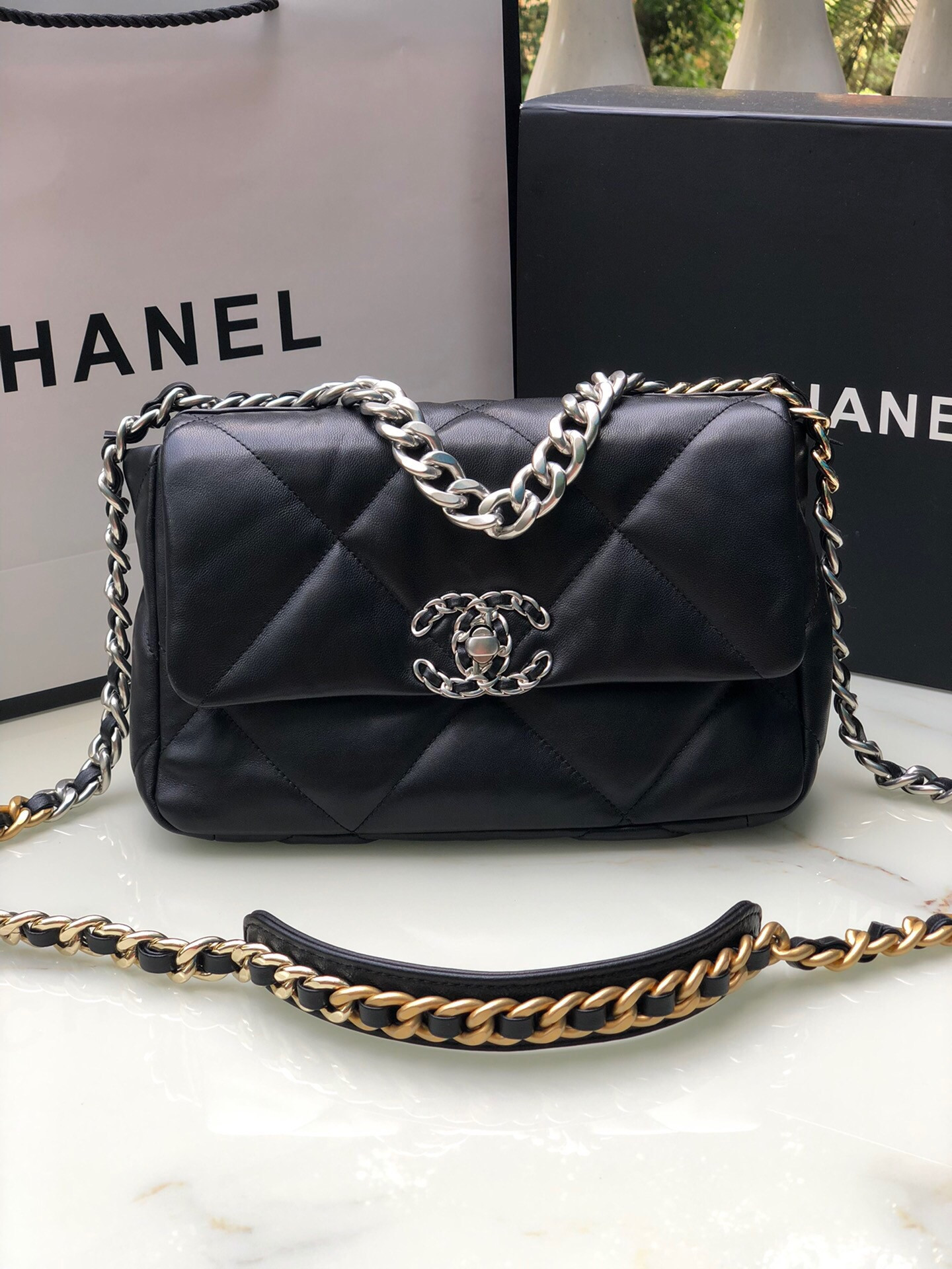 Ch*el 19 handbag shiny leather, gold-tone, silver-tone & ruthenium-finish metal black 6.2 × 10.1 × 3.5 in