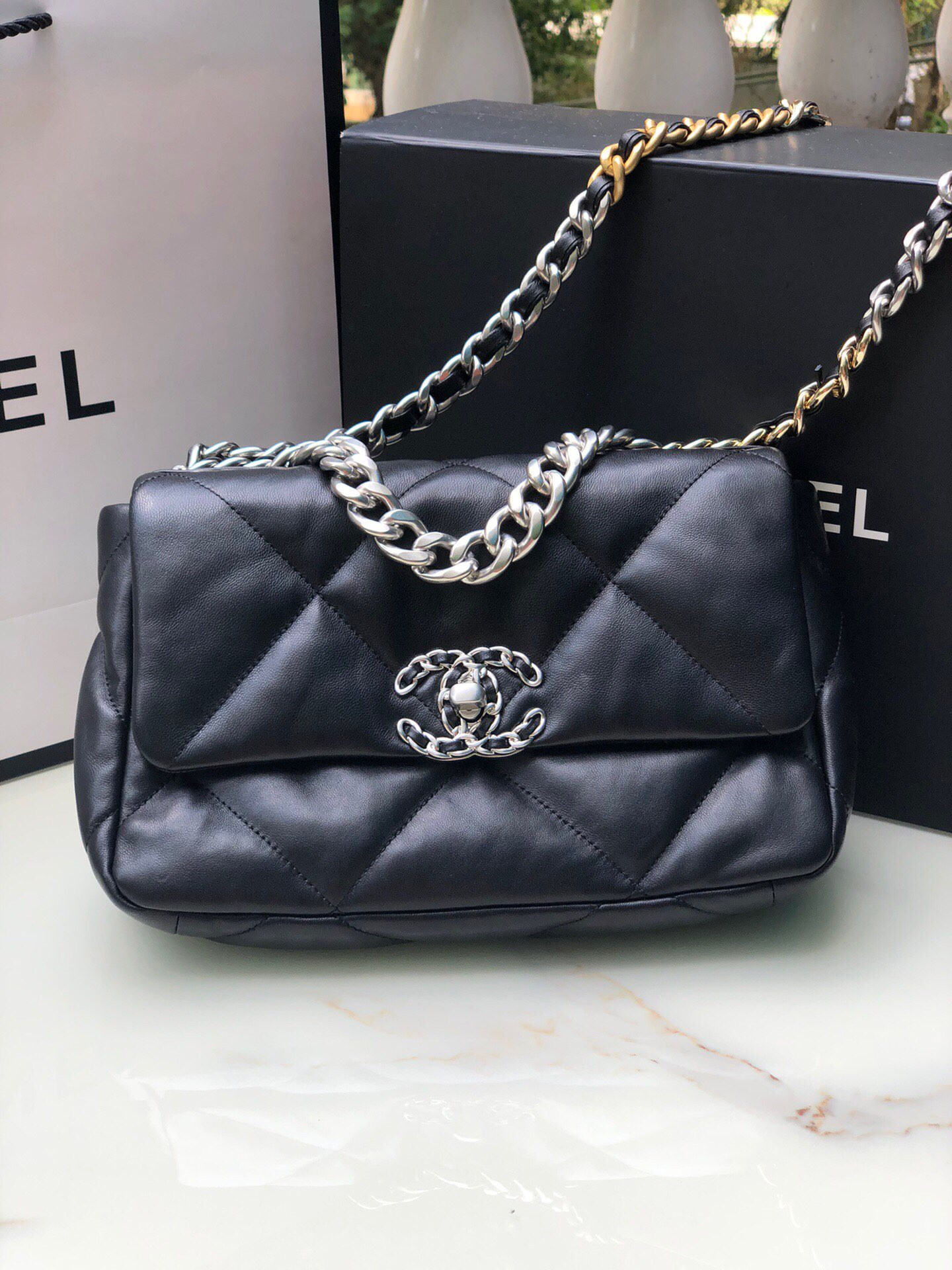 Ch*el 19 handbag shiny leather, gold-tone, silver-tone & ruthenium-finish metal black 6.2 × 10.1 × 3.5 in