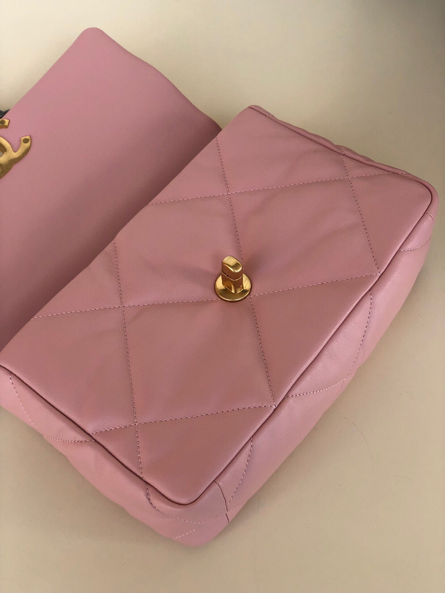 Ch*el 19 handbag shiny leather, gold-tone, silver-tone & ruthenium-finish metal light pink 6.2 × 10.1 × 3.5 in