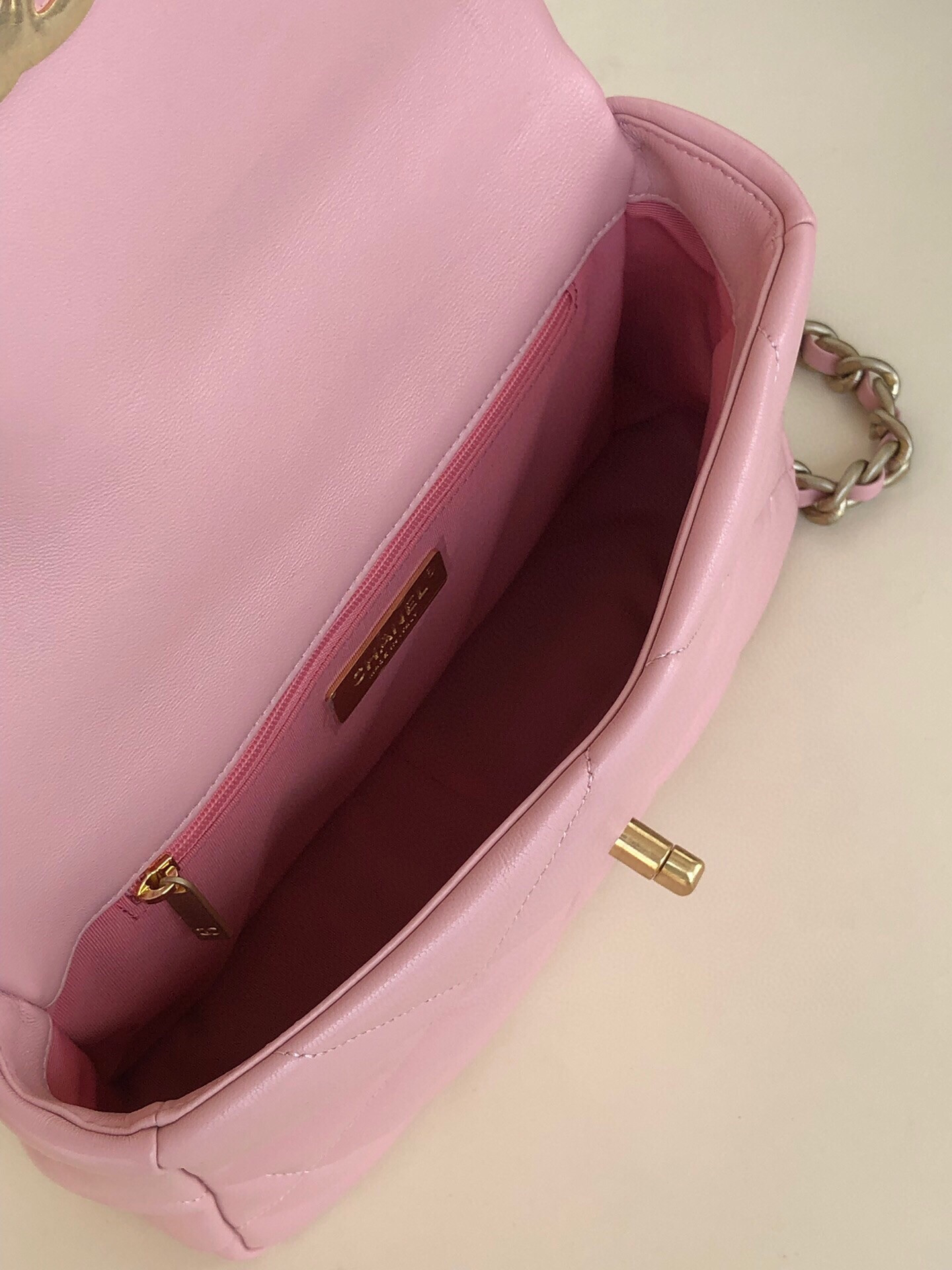Ch*el 19 handbag shiny leather, gold-tone, silver-tone & ruthenium-finish metal light pink 6.2 × 10.1 × 3.5 in