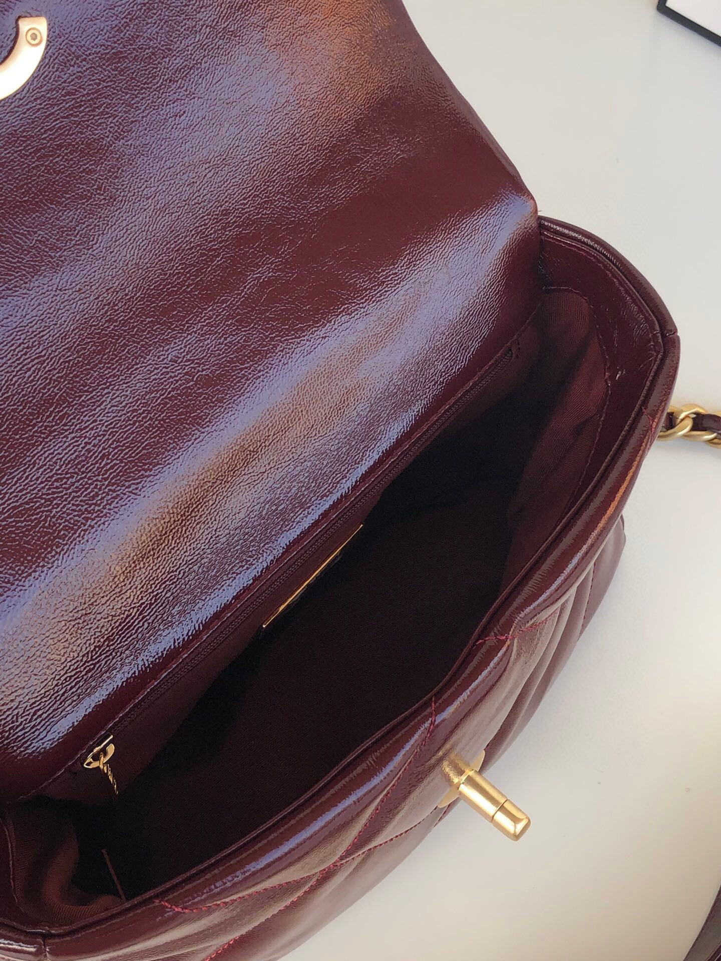 Ch*el 19 handbag shiny leather, gold-tone, silver-tone & ruthenium-finish metal dark red 6.2 × 10.1 × 3.5 in