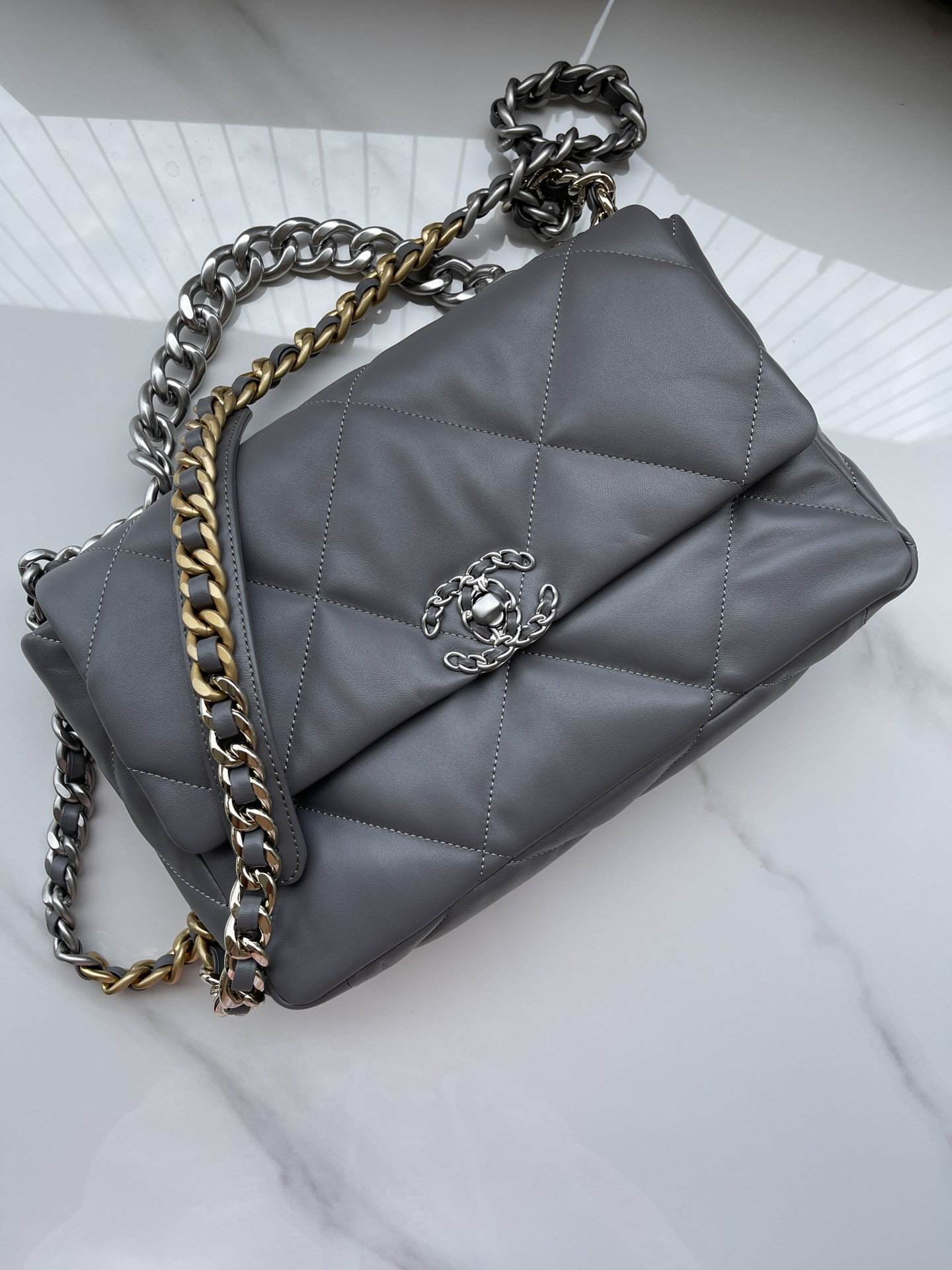 Ch*el 19 large handbag shiny leather, gold-tone, silver-tone & ruthenium-finish metal gray 7.8 × 11.7 × 3.9 in