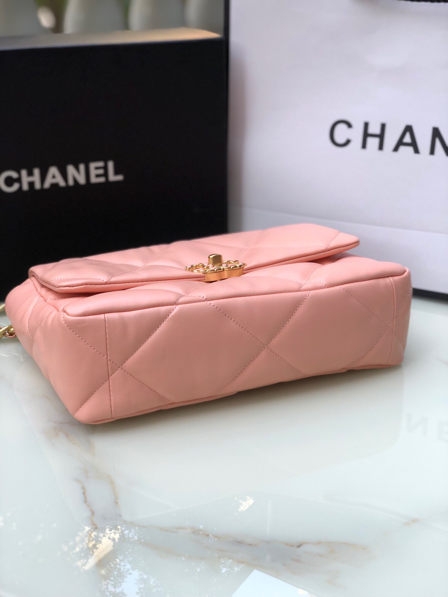 Ch*el 19 large handbag shiny leather, gold-tone, silver-tone & ruthenium-finish metal light pink 7.8 × 11.7 × 3.9 in