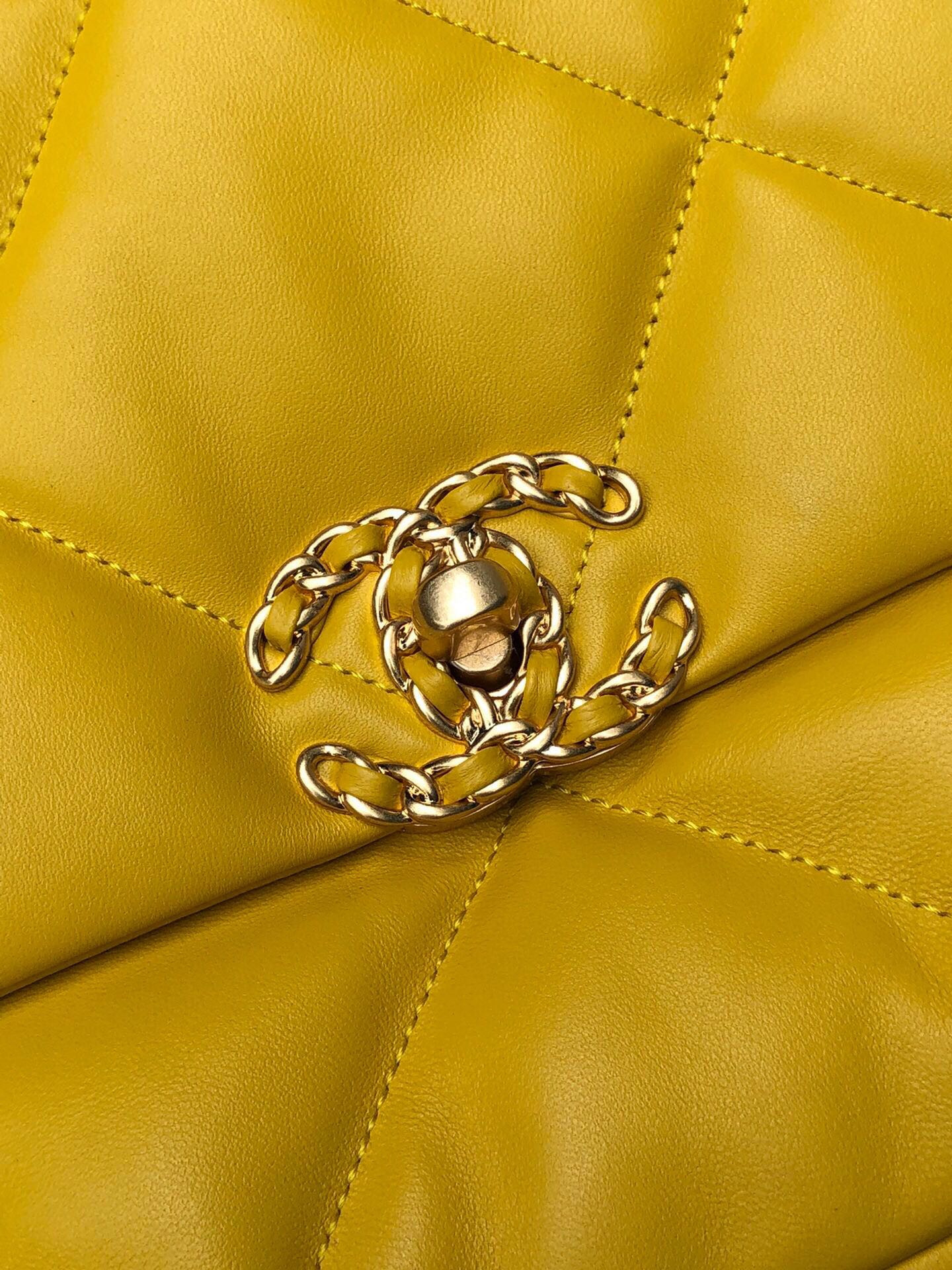 Ch*el 19 large handbag shiny leather, gold-tone, silver-tone & ruthenium-finish metal yellow 7.8 × 11.7 × 3.9 in
