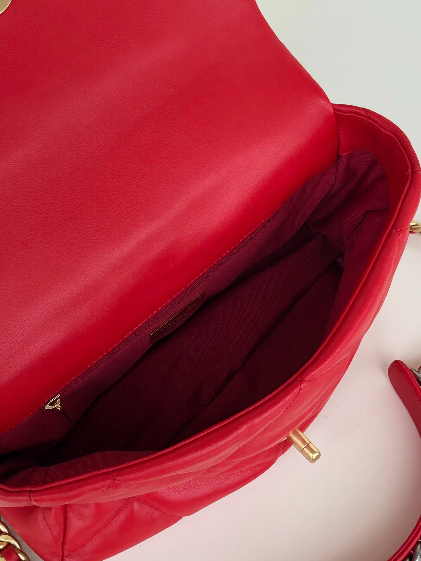 Ch*el 19 large handbag shiny leather, gold-tone, silver-tone & ruthenium-finish metal red 7.8 × 11.7 × 3.9 in