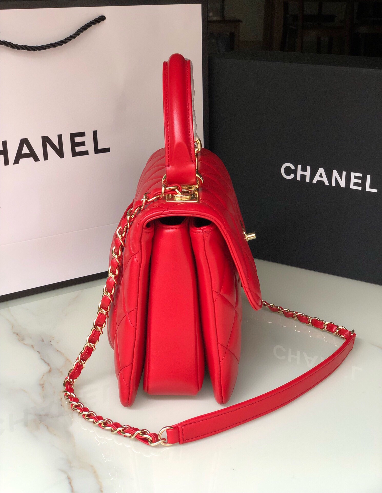 Ch*el flap bag with top handle 6.6 × 9.8 × 4.7 in