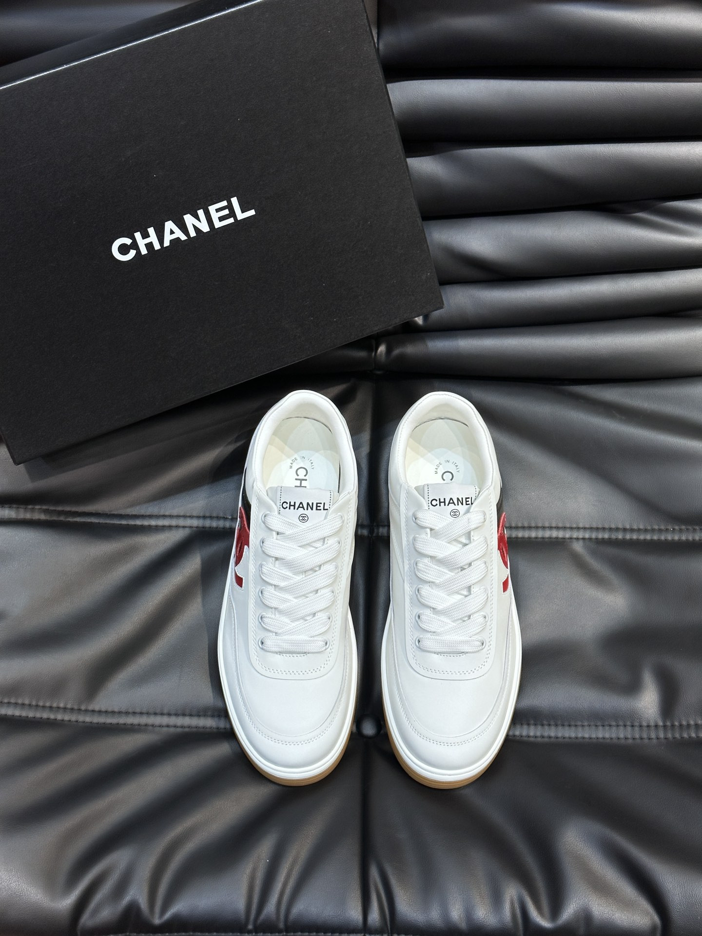 ua Ch*el sneaker calfskin