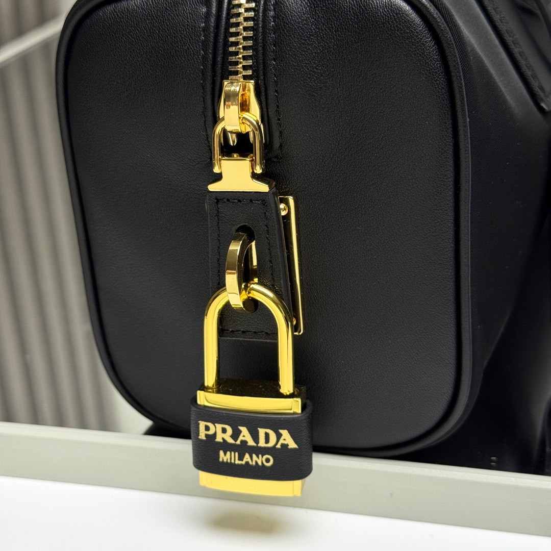 Pra*a re-nylon and leather medium top-handle bag with padlock 12.5x29x10cm