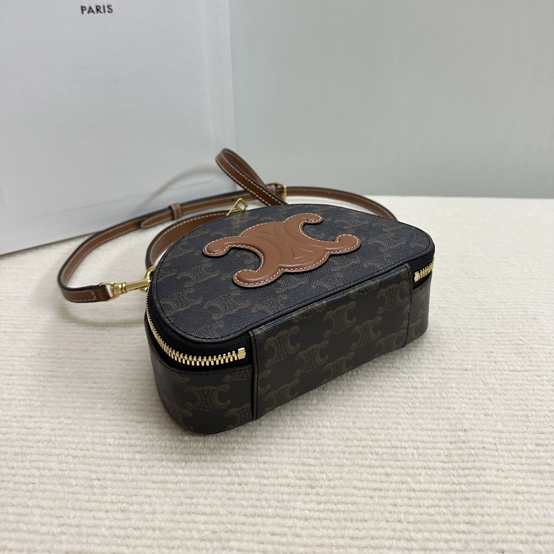 Ce**e half moon case in triomphe canvas and calfskin 17.5x12x6cm