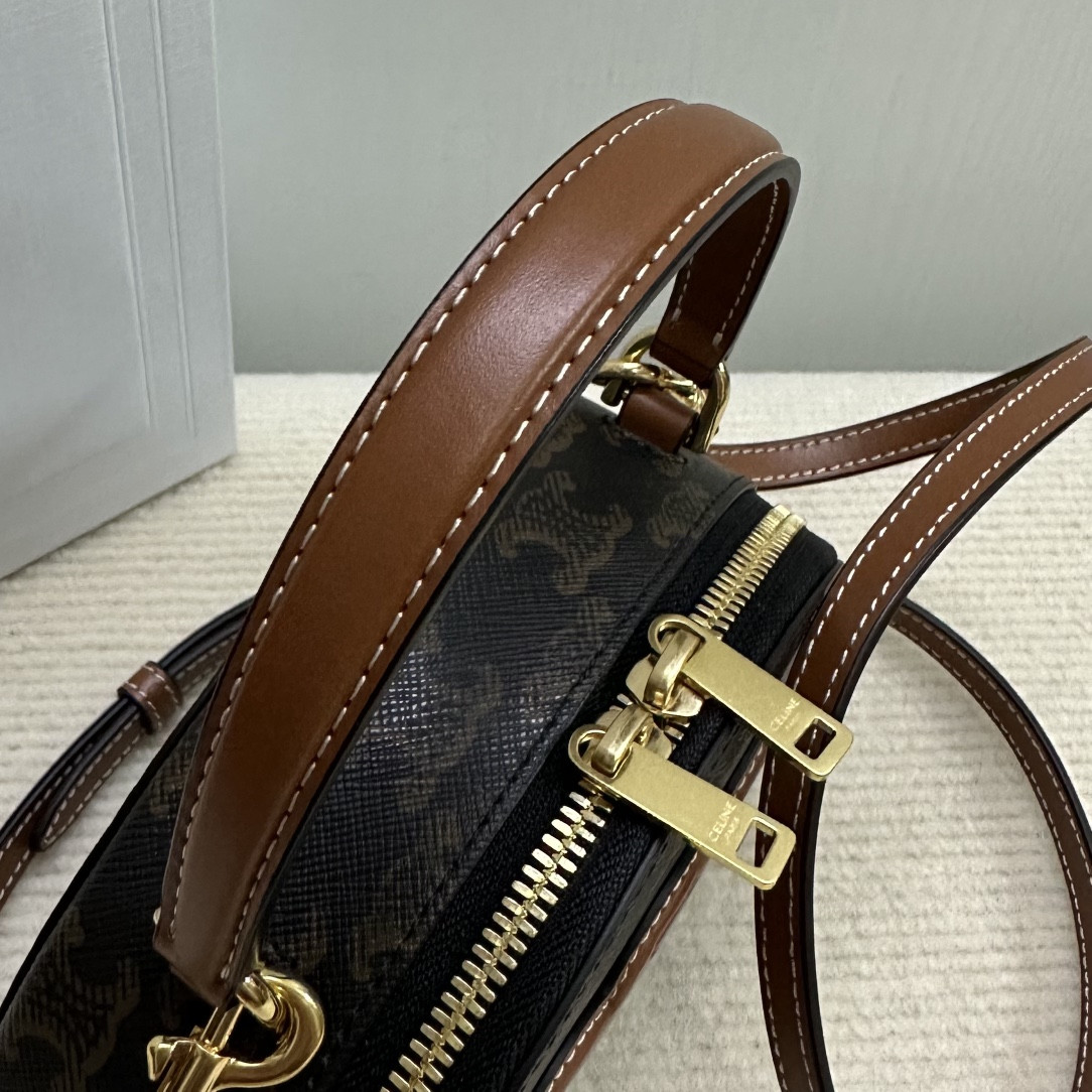 Ce**e half moon case in triomphe canvas and calfskin 17.5x12x6cm