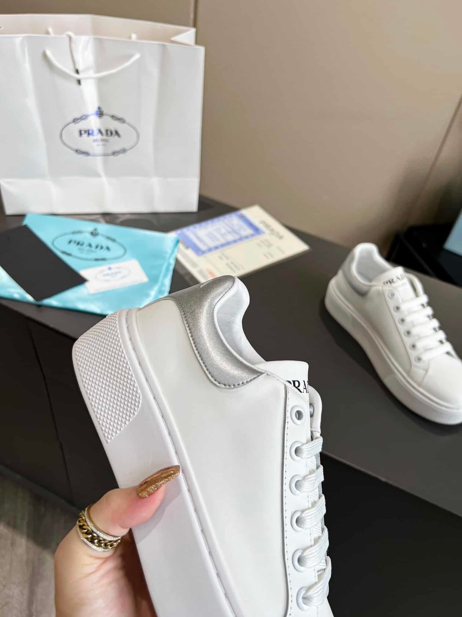 Pra*a Sneaker In White Leather With Silver Logo